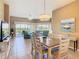 Bright living space with tile flooring and access to a screened lanai at 8774 Worldquest Blvd # 7503, Orlando, FL 32821