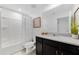 Cozy bathroom featuring tiled floors, single sink, and shower with tub at 8943 Amelia Downs Trl, Kissimmee, FL 34747