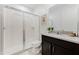 Clean bathroom featuring a glass-enclosed shower and modern vanity with a sleek design at 8943 Amelia Downs Trl, Kissimmee, FL 34747