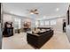 Spacious game room equipped with a pool table, TV, arcade game, and comfortable seating area at 8943 Amelia Downs Trl, Kissimmee, FL 34747