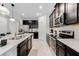 Well-equipped kitchen boasting granite countertops, stainless steel appliances, and ample cabinet space at 8943 Amelia Downs Trl, Kissimmee, FL 34747