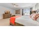 Stylish bedroom with a wooden sleigh bed, flat screen television and dresser at 8943 Amelia Downs Trl, Kissimmee, FL 34747