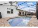 The backyard features a private pool and spa for relaxation and recreation at 8943 Amelia Downs Trl, Kissimmee, FL 34747