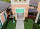 Entrance to the Solara Resort with beautiful landscaping, a walkway to the arcade, and excellent outdoor lighting at 8943 Amelia Downs Trl, Kissimmee, FL 34747