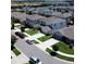 An aerial view shows a well-planned residential community with tree-lined streets and manicured lawns at 9016 Pyrus St, Kissimmee, FL 34747