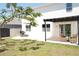 Backyard features a covered patio, grill, and lush lawn, perfect for outdoor entertaining and relaxing at 9016 Pyrus St, Kissimmee, FL 34747