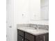 Bathroom vanity features granite counters, stainless steel faucet, and a white vessel sink at 9016 Pyrus St, Kissimmee, FL 34747