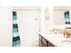 This bathroom features a shower-tub combo, modern granite vanity, and soft decor at 9016 Pyrus St, Kissimmee, FL 34747