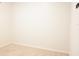 Clean empty bedroom with neutral carpet and bright white walls, ready to be filled at 9016 Pyrus St, Kissimmee, FL 34747