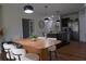 Well-lit dining area featuring modern furnishings and stylish pendant lighting at 9016 Pyrus St, Kissimmee, FL 34747