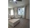 Living room featuring a comfy sofa, natural light and elegant curtains at 9016 Pyrus St, Kissimmee, FL 34747