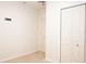 A bright room featuring two doors with one closed and the other slightly open, bright color scheme at 9016 Pyrus St, Kissimmee, FL 34747