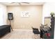 Bright room with a vanity, black chair and a speaker next to a massage table for maximum space at 9016 Pyrus St, Kissimmee, FL 34747