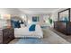 Well-lit primary bedroom with a large dresser, plush pillows, and neutral wall color at 9056 Pinch Shot Dr, Winter Garden, FL 34787