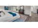 Bedroom showcases a dresser, light-colored walls, and modern flooring at 9056 Pinch Shot Dr, Winter Garden, FL 34787