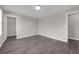 Spacious bedroom with hardwood floors, a walk-in closet, and neutral walls offering a versatile and inviting space at 9056 Pinch Shot Dr, Winter Garden, FL 34787
