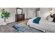 Bright bedroom featuring a dresser, stylish rug, and modern decor at 9056 Pinch Shot Dr, Winter Garden, FL 34787