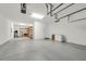 Spacious garage with ample room for multiple vehicles, shelving, and storage offering versatile functionality at 9056 Pinch Shot Dr, Winter Garden, FL 34787