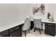Cozy home office with modern gray chairs, built-in desks, and ample natural light for a productive workspace at 9056 Pinch Shot Dr, Winter Garden, FL 34787