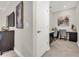 Well-lit home office space featuring built-in desks, ample storage, and modern decor, perfect for remote work at 9056 Pinch Shot Dr, Winter Garden, FL 34787