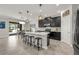 Bright open kitchen featuring an island with bar stools and an adjacent dining area at 9056 Pinch Shot Dr, Winter Garden, FL 34787