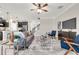 Open-concept living room and kitchen area featuring modern decor, sleek furniture, and tiled floors throughout at 9056 Pinch Shot Dr, Winter Garden, FL 34787