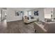 Open living area with neutral tones, hardwood floors, and modern furnishings at 9056 Pinch Shot Dr, Winter Garden, FL 34787