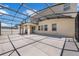 Large screened-in patio featuring a concrete floor and string lights, perfect for outdoor entertaining at 9056 Pinch Shot Dr, Winter Garden, FL 34787