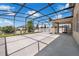 Expansive screened-in patio offering plenty of room for relaxation and gatherings, with views of the surrounding landscape at 9056 Pinch Shot Dr, Winter Garden, FL 34787