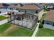 A screened patio featuring a spacious area for relaxing and entertaining at 9056 Pinch Shot Dr, Winter Garden, FL 34787