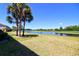 Picturesque backyard view with a serene pond and golf course, offering a tranquil and scenic outdoor space at 9435 Myrtle Creek Ln # 304, Orlando, FL 32832