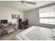 Bedroom featuring neutral paint, carpeted floors, desk, and a window providing natural light at 9435 Myrtle Creek Ln # 304, Orlando, FL 32832
