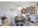 Charming dining room featuring a round table with seating for four, adjacent to the kitchen, perfect for Gathering meals at 9435 Myrtle Creek Ln # 304, Orlando, FL 32832