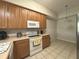 Cozy kitchen with ample cabinets, modern appliances, and a bright atmosphere perfect for home cooking at 9435 Myrtle Creek Ln # 304, Orlando, FL 32832