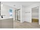 Modern bathroom features a dual vanity, glass shower, and a walk-in closet at 1003 Sugarwood St, Davenport, FL 33837