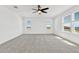 Bright bedroom with lots of natural light and neutral carpet at 1003 Sugarwood St, Davenport, FL 33837