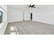 Spacious bedroom featuring neutral carpet, ceiling fan, and lots of natural light at 1003 Sugarwood St, Davenport, FL 33837