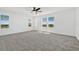 Large bedroom boasting ample natural light and plush carpet at 1003 Sugarwood St, Davenport, FL 33837
