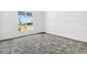 Clean bedroom with plush carpet and natural light from a large window at 1003 Sugarwood St, Davenport, FL 33837