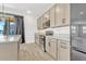 Contemporary kitchen with modern stainless steel appliances and lots of counter space at 1003 Sugarwood St, Davenport, FL 33837