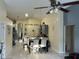 Open dining space flowing into the kitchen; neutral color palette, light tile flooring at 1019 Lake Berkley Dr, Kissimmee, FL 34746