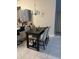 Cozy dining area featuring a dark wood table with upholstered chairs and modern light fixture at 1019 Lake Berkley Dr, Kissimmee, FL 34746