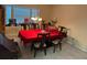 Traditional dining room featuring a red tablecloth and classic chandelier lighting at 1019 Lake Berkley Dr, Kissimmee, FL 34746