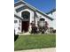 Charming home with a well-manicured lawn and landscaped garden beds with a pop of color at 1019 Lake Berkley Dr, Kissimmee, FL 34746