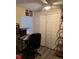 Functional home office with a desk, computer setup, and ample storage space at 1019 Lake Berkley Dr, Kissimmee, FL 34746