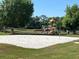 Gathering-friendly playground area with a sandy volleyball pit and various playing equipment at 1019 Lake Berkley Dr, Kissimmee, FL 34746