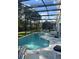 Enjoy a refreshing dip in this screened-in pool with plenty of seating and backyard views at 1019 Lake Berkley Dr, Kissimmee, FL 34746