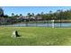Enjoy friendly matches on this community tennis court, surrounded by lush greenery and blue skies at 1019 Lake Berkley Dr, Kissimmee, FL 34746