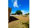 Large backyard featuring a fire pit, storage shed, and white picket fence at 1102 Peregrine St, Groveland, FL 34736