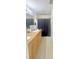 Bathroom featuring dual sinks, granite countertops, and shower with dark curtain at 1102 Peregrine St, Groveland, FL 34736